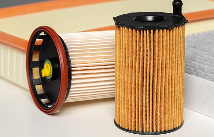 Bi-component fibers for filtration